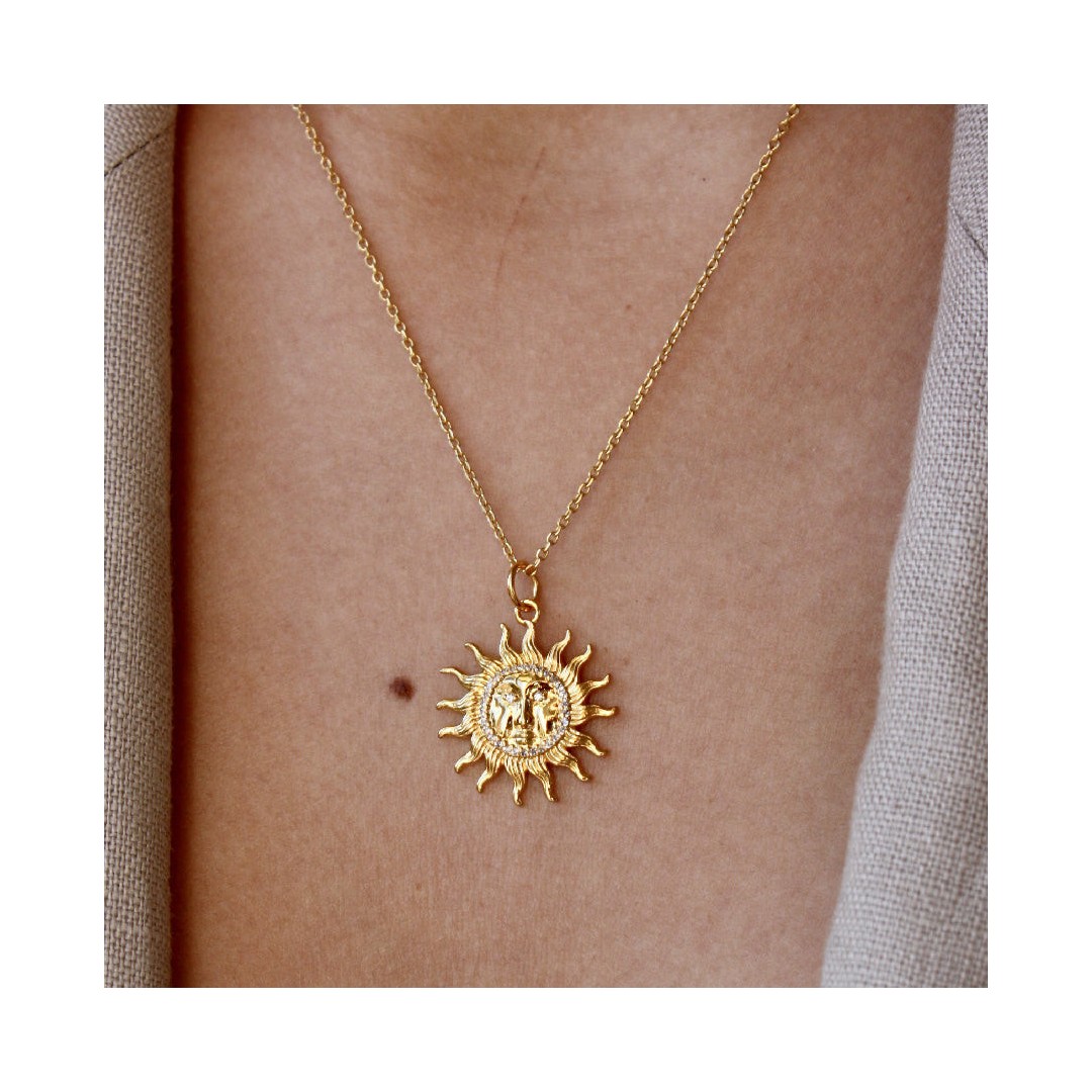 Gold sun medallion necklace with 